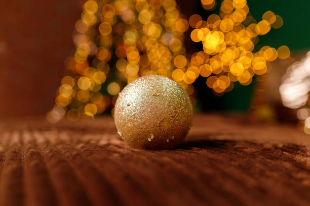 istock Golden Christmas Balls From A Christmas Tree Branch 1199190656