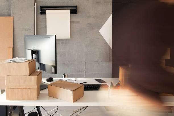 istock Delivery service, working in warehouse with packages 1199190968