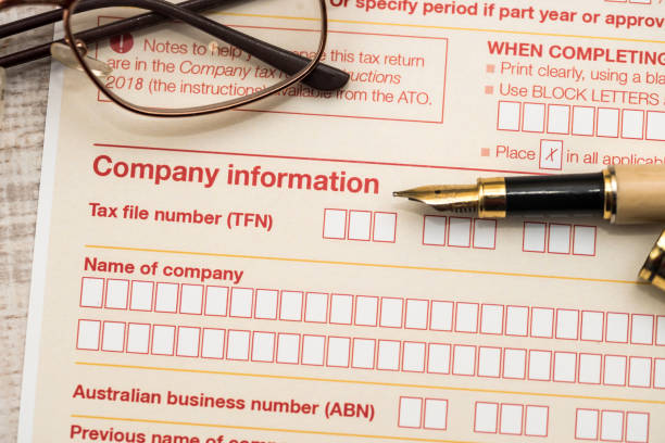 istock Australian tax declaration and pen on wooden table 1199192945