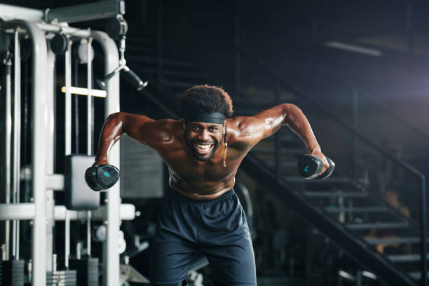 istock Sportsman Doing Exercise With Dumbbells 1199193313