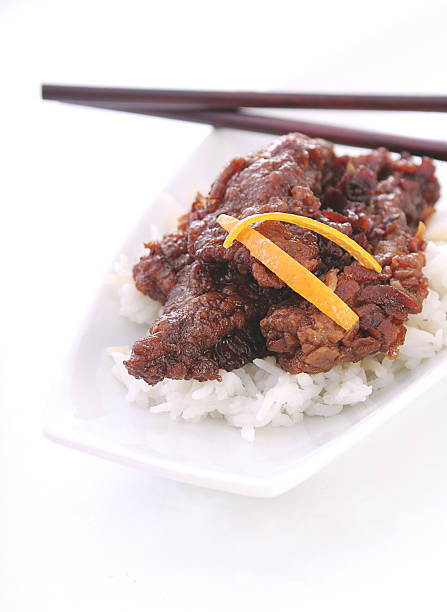 laranja carne bovina refogado - beef rice orange stir fried - fotografias e filmes do acervo