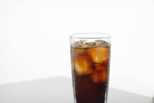 istock Cold refreshing cola glass with ice on white background with space for text. Icy beverage of cool drink with caffeine 1199195053
