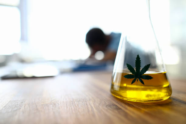 jar with cannabis sign - photography sign table ganja imagens e fotografias de stock