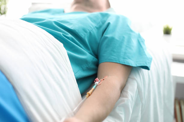 istock Patient with catheter in hand 1199195457