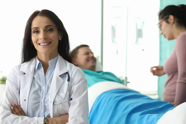 istock Cute doctor with crossed hands 1199195485