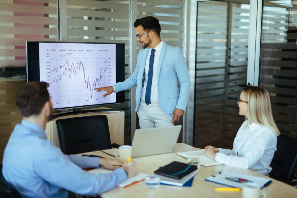 istock Businessman leading presentation in meeting room 1199197332