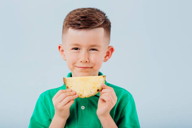 700+ Child Eating Pineapple Stock Photos, Pictures & Royalty-Free Images -  iStock