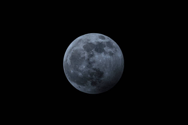 istock Full moon in the dark winter night with clearly visible moon surface during a weak partial eclipse 1199199152