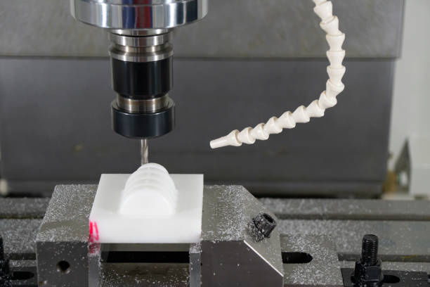 istock The CNC milling machine finishing cut the plastic parts with the solid ball  endmill tools. 1199200669