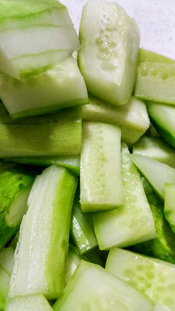 istock Fresh cut cucumber chunks on a serving plate 1199201476