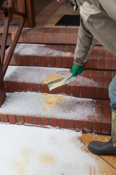 istock Hand sprinkles slippery steps with dry sand 1199203465