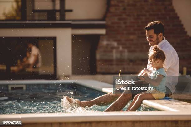 Father And Daughter Funny Time By The Pool Stock Photo - Download Image Now - Family, Swimming Pool, Vacation Rental