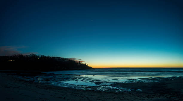 Twilight seascape at low tide on Old Silver Beach on Cape Cod