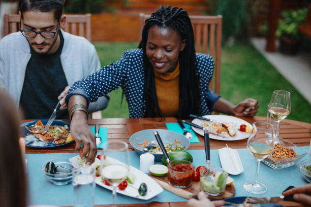 istock Millennial friends having vegan dinner 1199210684