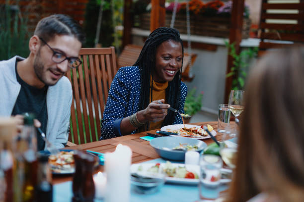 istock Millennial friends having vegan dinner 1199210691