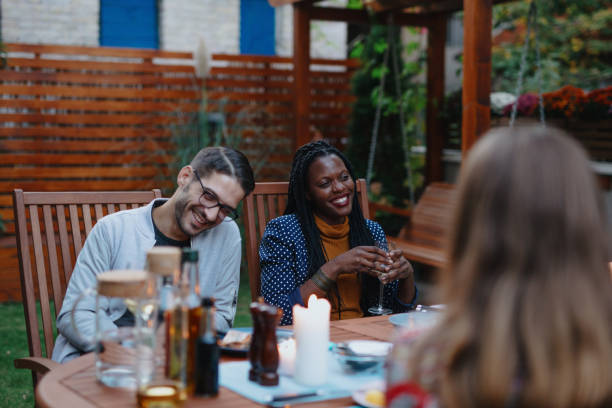 istock Friends having discussion over dinner 1199210931