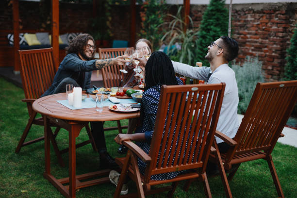istock Dinner party guests talking at the table 1199211100