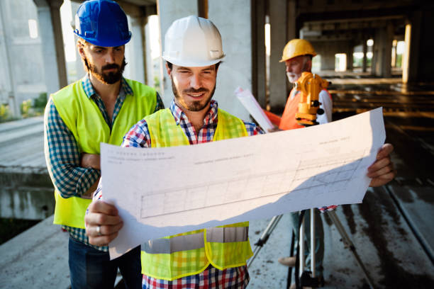 istock Architect and construction engineer or surveyor discussion plans and blueprints 1199213537