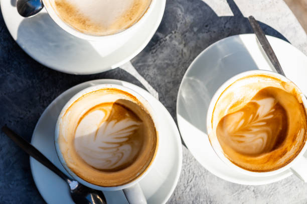istock Three Empty Cups of flat white coffee in the cafe, 1199215109