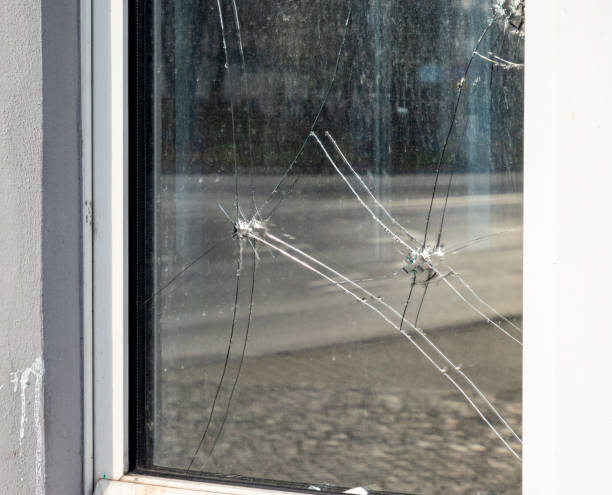 istock Bullet holes in a window pane 1199215362