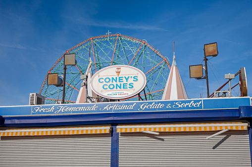 Coney Island, Brooklyn, New York, USA, December 12, 2019: Winter closed shop in front of Ferris wheel