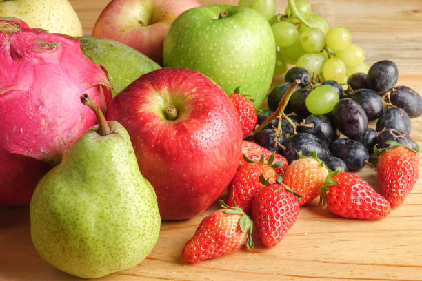 istock Set of different fruits on wooden table. 1199216498