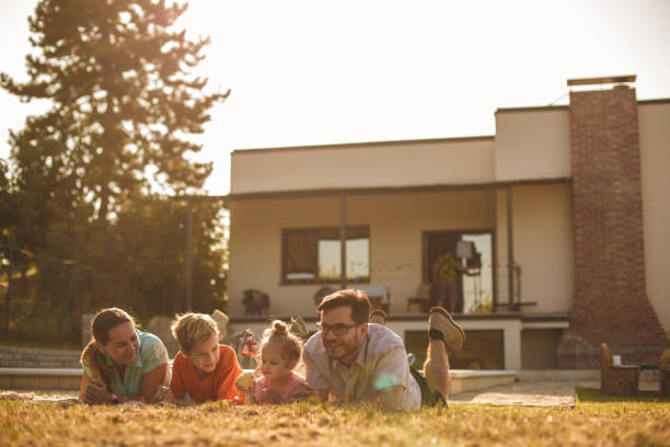 istock In front of their first house during sunny day. 1199216558