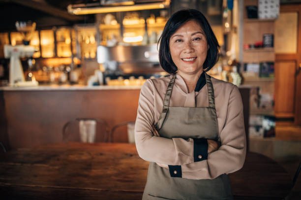 istock Senior lady cafe owner and waitress 1199216870