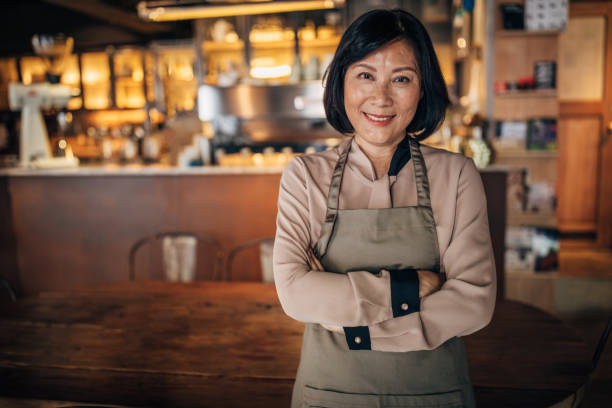 istock Senior lady cafe owner and waitress 1199216892