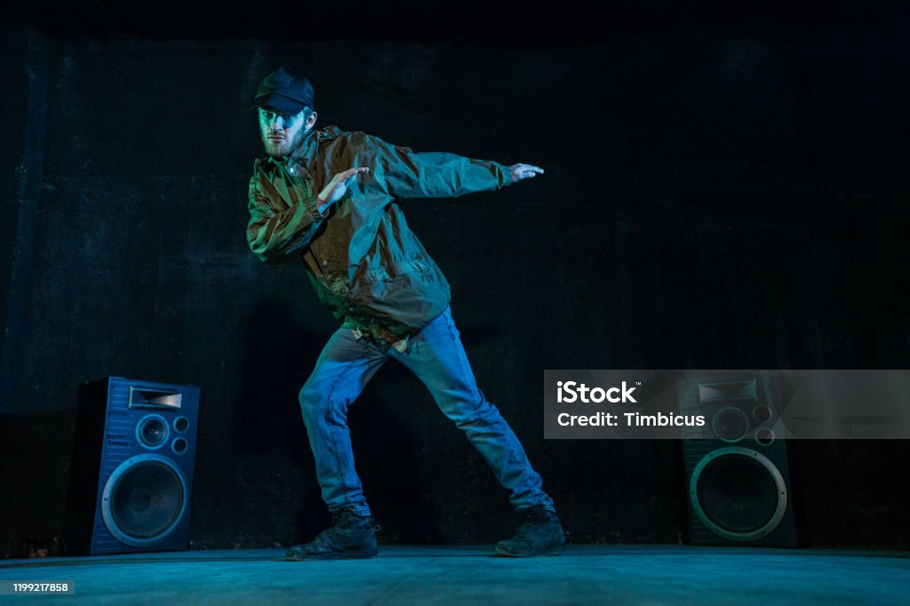 Young Dancer Performing On Blue Light Stock Photo - Download Image Now