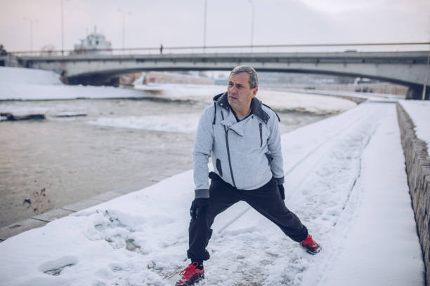 istock Running in the winter by the river 1199218030