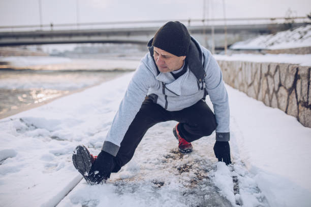 istock Running in the winter by the river 1199218080