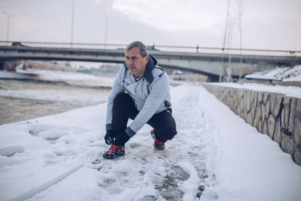 istock Running in the winter by the river 1199218187