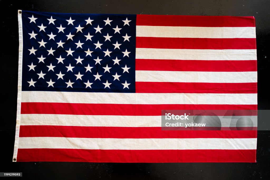 USA flag on black concrete background, flatlay American Flag Stock Photo