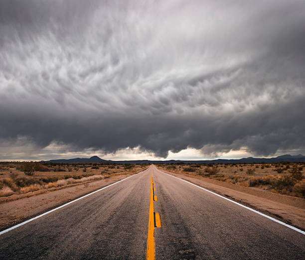 Stormy Road  storm cloud sky dramatic sky cloud stock pictures, royalty-free photos & images