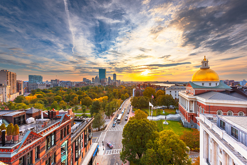 Boston, Massachusetts, USA cityscape with the State House at dusk.