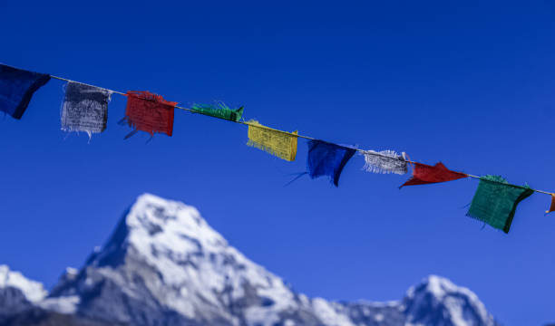 istock Buddhist Shrine Mountain with prayer flags over the blue sky. 1199227595