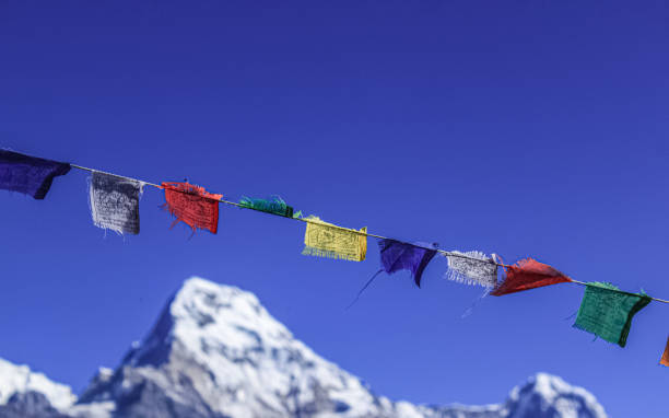 istock Buddhist Shrine Mountain with prayer flags over the blue sky. 1199227688