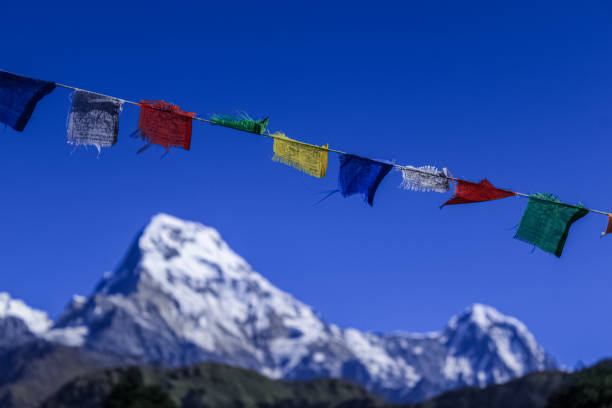 istock Buddhist Shrine Mountain with prayer flags over the blue sky. 1199227770