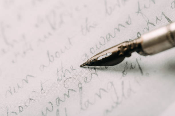istock fountain pen on paper with ink text closeup 1199228161