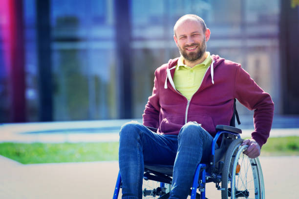 happy man on wheelchair stock photo