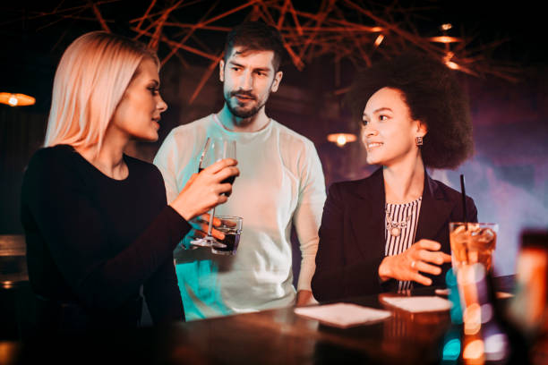 istock A diverse group of millennial friends having fun together with drinks during a night out 1199229351