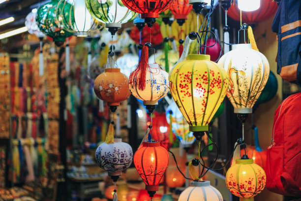 one of the numerous colorful paper lantern shops in hoi an, vietnam - vibrant color new traditional culture saturated color imagens e fotografias de stock