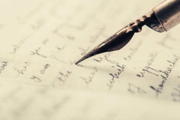istock fountain pen on paper with ink text closeup 1199229951
