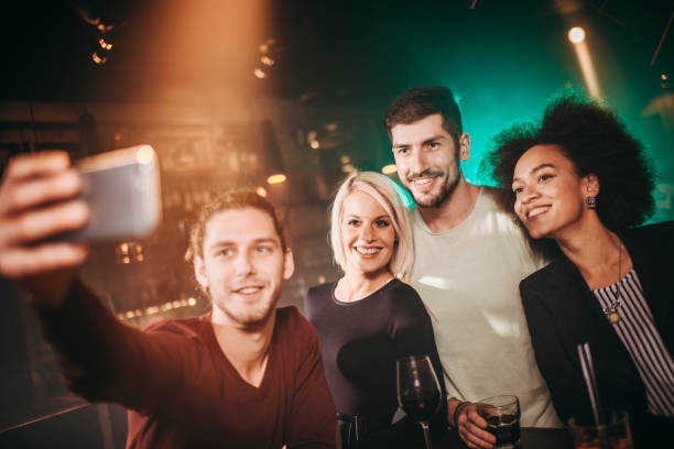 istock Millennials taking a selfie while partying in a night club 1199230015