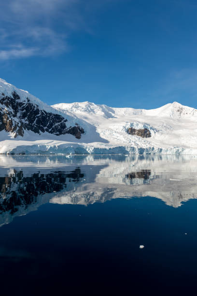 istock Antarctic seascape with icebergs and reflection 1199230213