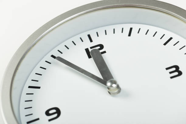 istock white with light metal minimalistic wall clock close-up on a light background 1199231142