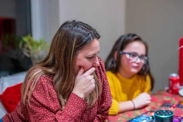 istock Mother and daughter playing board game 1199231466