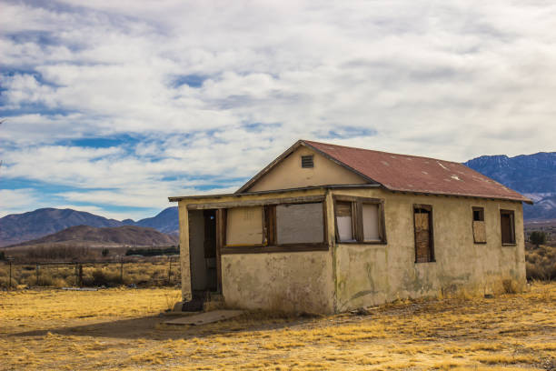 istock Old Small House With Boarded Up Windows 1199232588