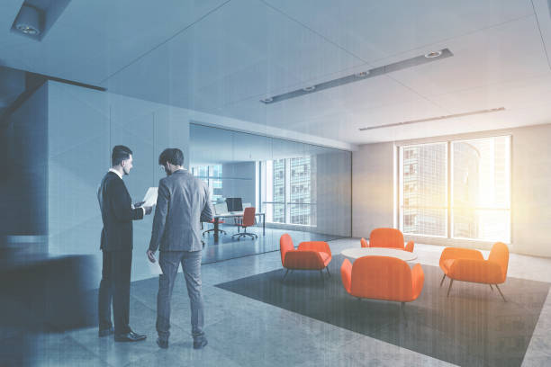 istock Business people in office lounge area 1199232847